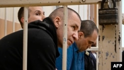 Three lawyers who represented late opposition leader Aleksei Navalny -- Igor Sergunin, Aleksei Liptser, and Vadim Kobzev appear in court in the town of Petushki in Russia's Vladimir region on September 12.