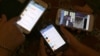 Iranians display their smart phones using the Telegram messenger application. File photo