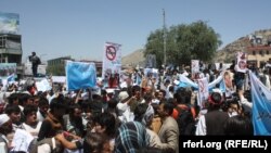 Supporters of Afghan presidential candidate Abdullah Abdullah demonstrate in Kabul on June 21.