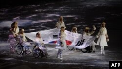 Түштүк Кореянын Пхёнчхаң шаарында дүйнөлүк 23-кышкы Олимпиада оюндары ачылышы. Эки Кореянын өкүлдөрү. 9-февраль, 2018-жыл.