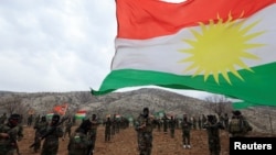 Iranian Kurdish fighters from the Kurdistan Freedom Party (PAK) take part in a training session at a base on the outskirts of Erbil, Iraqi Kurdistan, on February 12.