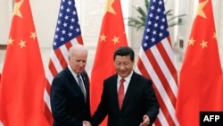 Foto e vitit 2013 gjatë një takimi të presidentit kinez, Xi Jinping me ish-nënpresidentin Joe Biden. 