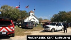 Police secure the site of a mass shooting in Sutherland Springs, Texas, on November 5.