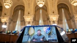 Ukrainian President Volodymyr Zelenskiy addresses the opening session of the Three Seas Initiative via video link at the Cotroceni Presidential Palace in Bucharest on September 6.