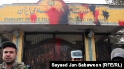 Afghanistan- Afghan police guard entrance of Iranian Embassy hit with red paint by protestors, Kabul,13Jan2011