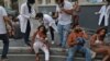 Graphic content / Wounded people are pictured outside a hospital following an explosion in the Lebanese capital Beirut on August 4, 2020