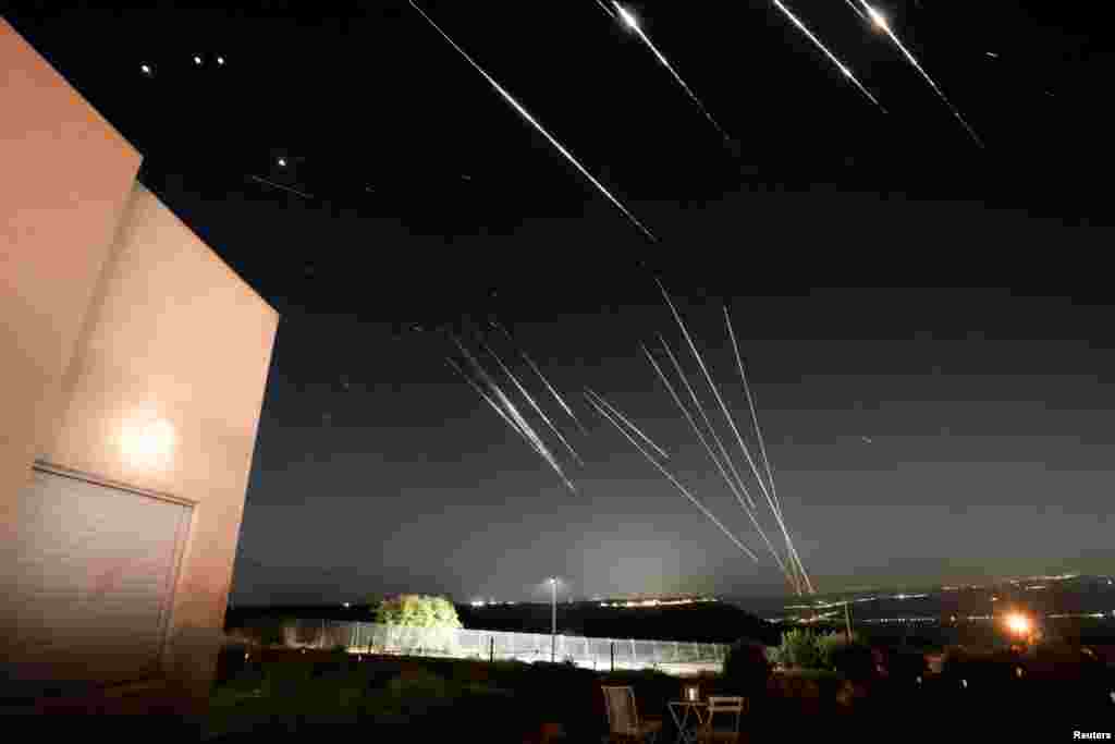 Missiles launched from Iran are intercepted by Israeli air defenses -- as seen from the Israeli-occupied Golan Heights.