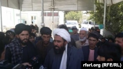 An angry crowd gathers outside Uruzgan’s provincial health department in Tarin Kowt on September 26. Demonstrators also protested outside the province’s main hospital in Tarin Kowt.