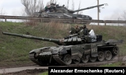 Tanks of pro-Russian troops on a road near the southern port city of Mariupol on April 17.