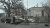 Ukrainian servicemen gather around a vehicle near the frontline town of Pokrovsk on November 11.