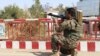 An Afghan army soldier taking aim at insurgents inside Kunduz city.