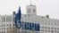 Russia -- The company logo of natural gas producer Gazprom is seen on an advertisement in front of the White House in Moscow, 08Feb2013