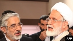 Mir Hossein Musavi (left) and Mehdi Karrubi