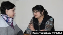 Kazakh journalist Guzyal Baidalinova (right) and her lawyer Inessa Kisileva confer in Almaly district court in December.