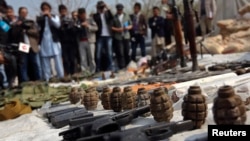 Weapons and ammunition seized from captured suspected Taliban are presented to the media at the National Directorate of Security (NDS) headquarters in Kabul on March 15.