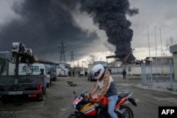 Smoke rises in the distance after a Russian attack on the Ukrainian port city of Odessa on April 3.