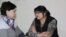 Kazakh journalist Guzyal Baidalinova (right) and her lawyer Inessa Kisileva confer in Almaly district court in December.