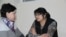 Kazakh journalist Guzyal Baidalinova (right) and lawyer Inessa Kisileva talk in Almaly district court in December.
