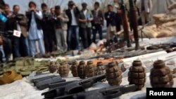 Weapons and ammunition seized from captured suspected Taliban are presented to the media at the National Directorate of Security (NDS) headquarters in Kabul on March 15. 