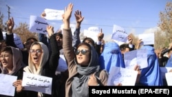 AFGHANISTAN -- Hazara minority community from Malistan and Jaghuri district of restive Ghazni province, shout slogans against the deteriorating security situation in their resident districts as they arrive in Ghazni city to take refuge, in Ghazni, Novembe