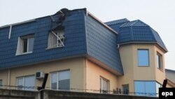 The roof of the Polish Consulate in Lutz was damaged overnight by an unidentified large-caliber weapon on March 29.