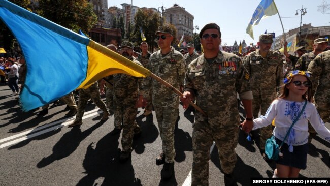 Під час Маршу ветеранів війни України з Росією у День Незалежності України, який був організований у відповідь на скасування президентом України Володимиром Зеленським військового параду. Київ, 24 серпня 2019 року