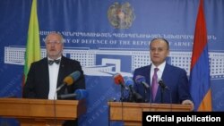 Armenia - Defense Minister Seyran Ohanian (R) and his visiting Lithuanian counterpart Juozas Olekas at a news conference in Yerevan, 23Apr2014.