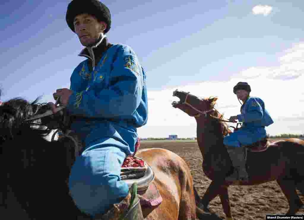 Horsemen from the Kazakh team after a match at the first Asian kokpar championship in Astana on September 12, 2013. 