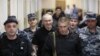 Михаила Ходорковского конвоируют в зал суда. Москва, 2011 год.