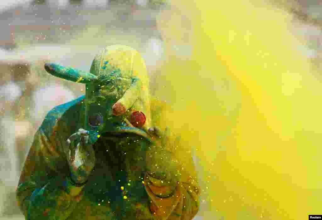 A participant is covered in colored powder during Kyiv&#39;s annual Color Run on June 4. (Reuters/Valentyn Ogirenko)