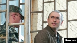 Jailed former oil magnate Mikhail Khodorkovsky (right) was unexpectedly released this week. (file photo)