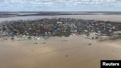 An aerial view shows a settlement surrounded by rising floodwaters in the North Kazakhstan region, Kazakhstan, on April 16.