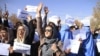 Hazara protest against the deteriorating security situation as they arrive in Ghazni city to take refuge on November 12.