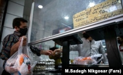 A man buys chicken in Tehran (file photo)