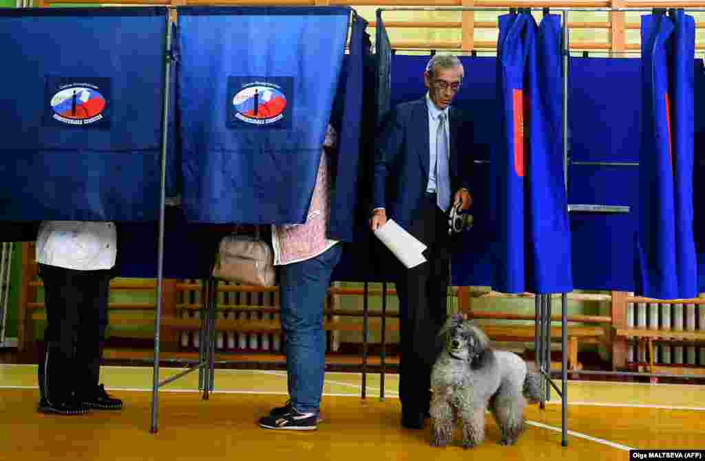 A man comes out of a polling booth in St. Petersburg.