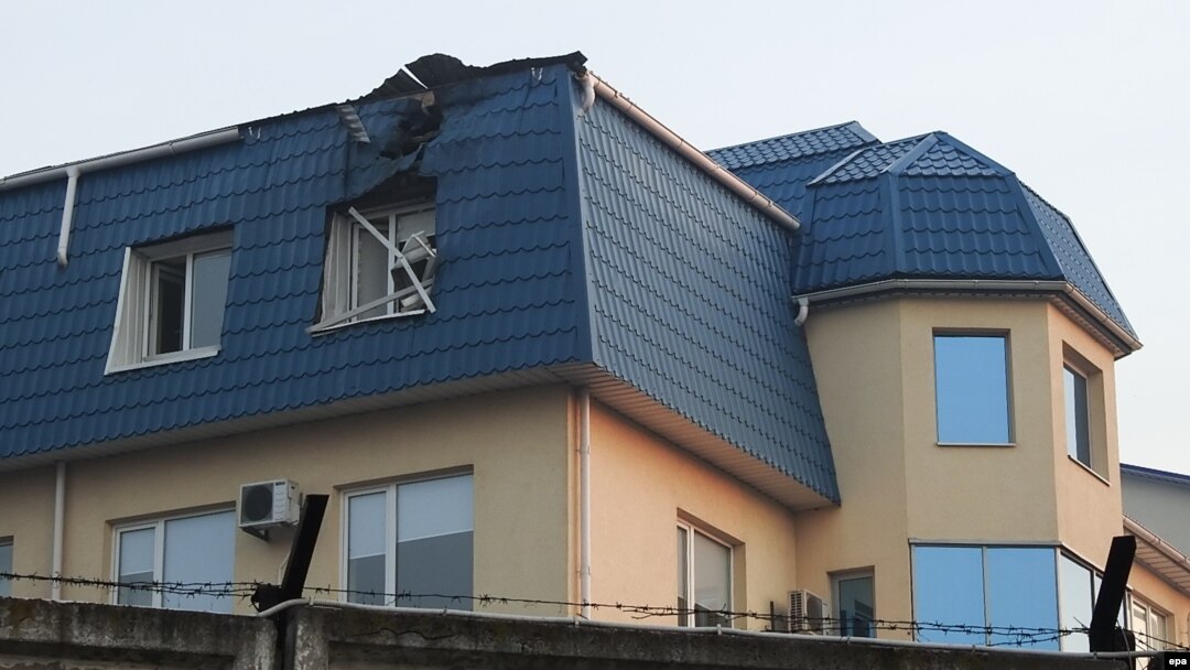 The roof of the Polish Consulate in Lutz was damaged overnight by an unidentified large-caliber weapon on March 29.