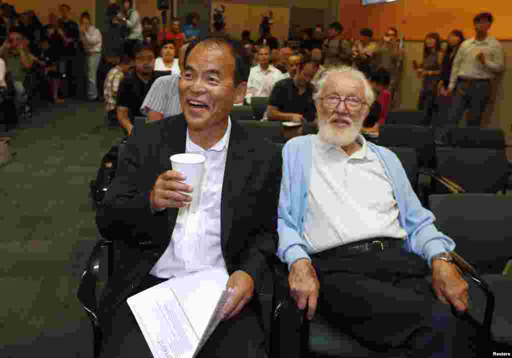 Japanese-born U.S. citizen Shuji Nakamura (left) laughs as he waits to speak at a news conference in California after winning the 2014 Nobel Prize for Physics. He is pictured with 2000 Nobel Prize for Physics winner Herbert Kroemer. Nakamura and two Japanese scientists -- Isamu Akasaki and Hiroshi Amano -- won the Nobel Prize for inventing a new energy-efficient and environmentally friendly light source, leading to the creation of modern LED light bulbs. (Reuters/Lucy Nicholson) 