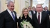 Russian President Vladimir Putin (R), Israeli Prime Minister Benjamin Netanyahu (L) and his wife Sara Netanyahu attend a meeting at the Kremlin in Moscow, February 27, 2019