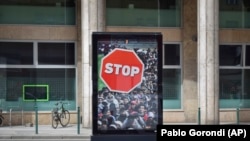 An antimigration billboard is placed by the Hungarian government in Budapest ahead of the April 8 election.