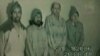 A January 28 video grab from Al-Jazeera showing Fox (second from left) with other members of the group of kidnapped Christian peace activists.