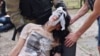 First responders help a victim of a Russian glide bomb strike in Kharkiv that followed an especially massive and destructive overnight drone attack against the city on June 7.