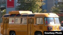 A converted Uzbek bus with a propane tank on the roof