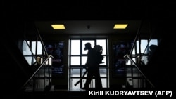 A Russian Emergencies Ministry serviceman disinfects Moscow's Savelovsky railway station on October 26.