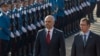 Albanian Prime Minister Edi Rama (L) and his Serbian counterpart Aleksandar Vucic inspect the honour guard during an official welcoming ceremony in Belgrade November 10, 2014. Albanian Prime Minister Rama became the first Albanian leader to visit Serbia s