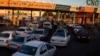 There were long lines at gas stations across Iran on October 26 after a government system managing fuel subsidies was badly disrupted by what state television said was a cyberattack. 