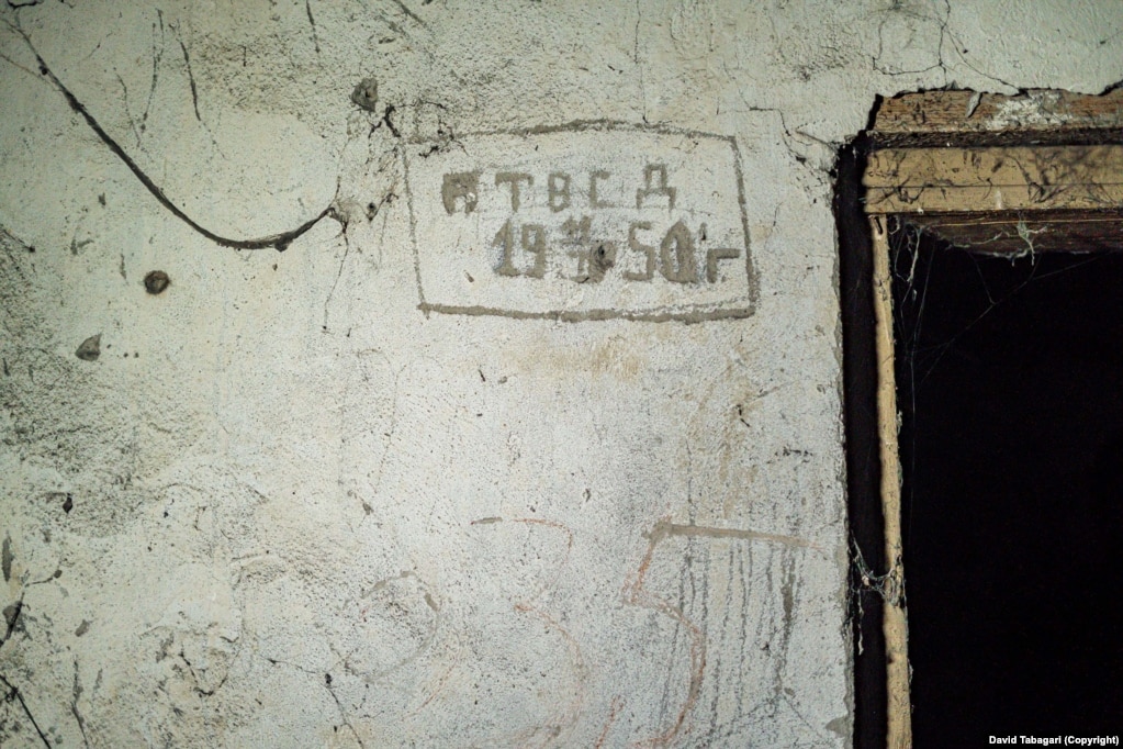 Graffiti apparently dating to the Stalin era inside one of the cells in the underground prison.