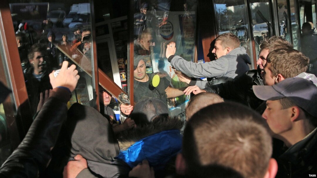 After a peaceful demonstration earlier in the day in the Biryulevo neighborhood of Moscow, gangs of mostly young men broke shop windows and inflicted other damage on the area, many of them chanting nationalistic slogans as the unrest mounted.