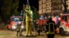 German firemen remove a 4-meter-tall golden statue of Turkish President Recep Tayyip Erdogan in the western German town of Wiesbaden on August 28. 