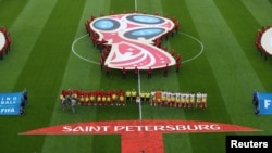 Soccer Football - World Cup - Group B - Morocco vs Iran - Saint Petersburg Stadium, Saint Petersburg, Russia - June 15, 2018 Players line up before the match REUTERS/Lee Smith