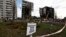 A mine-warning sign is seen in front of buildings that were destroyed by Russian shelling in Borodyanka, outside Kyiv, on April 7.